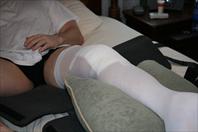 Laura taking off the bandages and re-dressing my knee after my surgery.