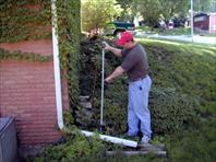 John Wray measuring for the landscaping
