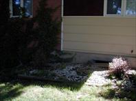 John Wray measuring for the landscaping on Maple drive