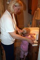 Mary and Laura getting ready in the morning - taken at the house on maple drive May 2009