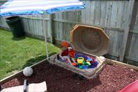 Mary got some crazy purple sand for her sand box!
