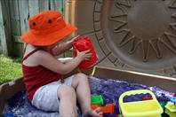 Mary got some crazy purple sand for her sand box!